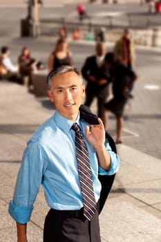 A casual candid portrait of an Asian looking business man