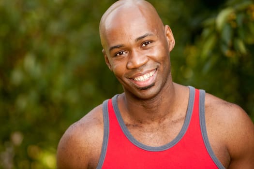 A portrait of an African American man taking a break while exercising