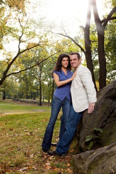 A happy couple relaxing in the park