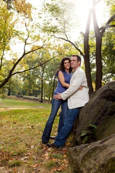 A happy couple relaxing in the park
