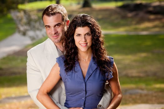 A portriat of a happy couple in the park.
