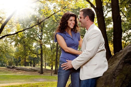 A happy couple relaxing in the park