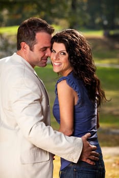 A happy couple in the park having fun on a warm day