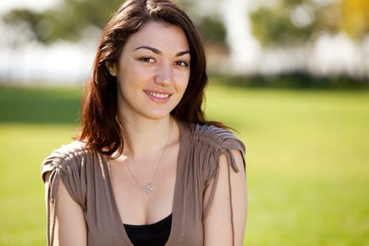 Young female model in outdoor setting. Horizontally framed shot.