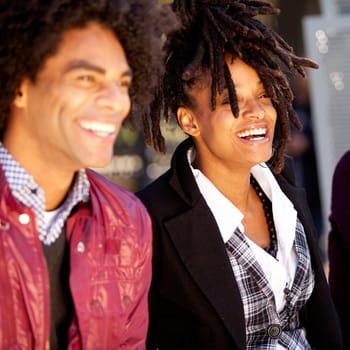 A candid portrait of a group of friends - shallow depth of field with focus on woman