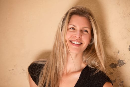 A casual portrait of a happy beautiful smiling woman