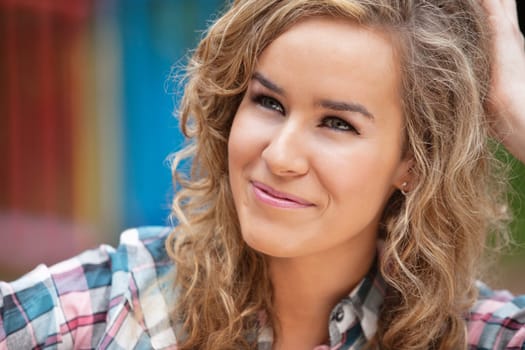 Beautiful young woman looking away and smiling