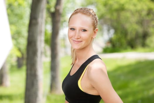 Beautiful woman smiling against blur background a