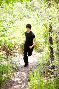 Man jogging during morning walk against blur background