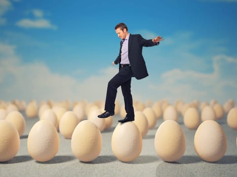 caucasian businessman walk on 3d eggs