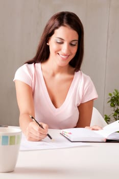 A woman making business plans sitting at a desk