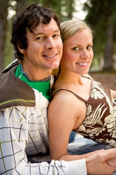 An outdoor portrait of a happy couple on a camping trip