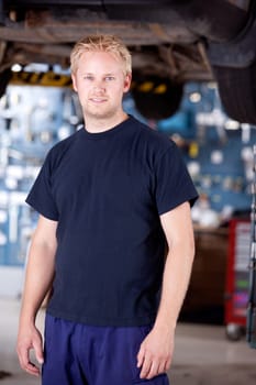 Portrait of a mechanic looking at the camera in auto repair shop