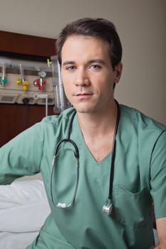 Portrait of young male doctor in hospital