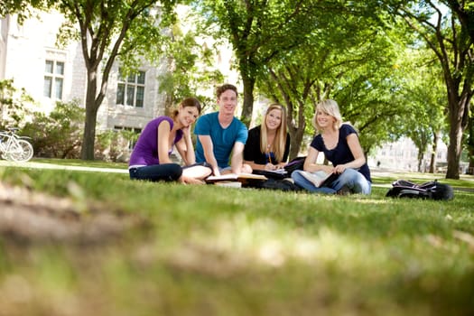 Happy group of university students looking at the camera