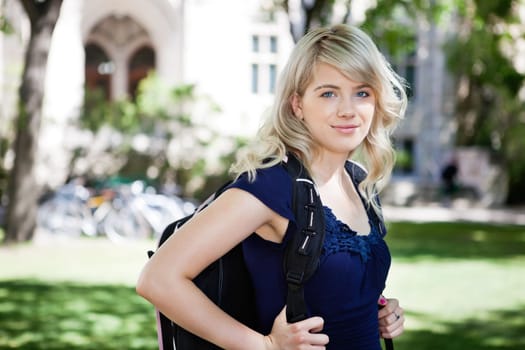 Portrait of sweet college girl with backpack