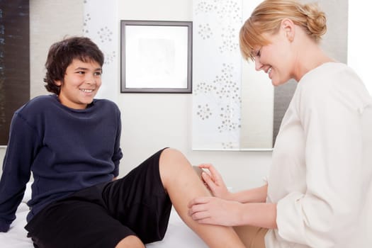 Young male at acupuncture clinic receiving Shoni-Shin treatment