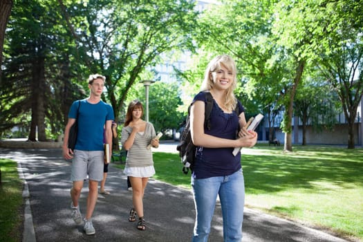 Group of students on their way to class walking through campus