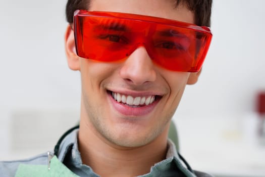 Portrait of dental patient wearing protective eyewear