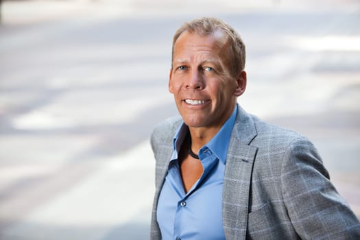 Close-up portrait of smiling businessman