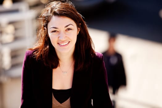 A candid portrait of a young woman in the city