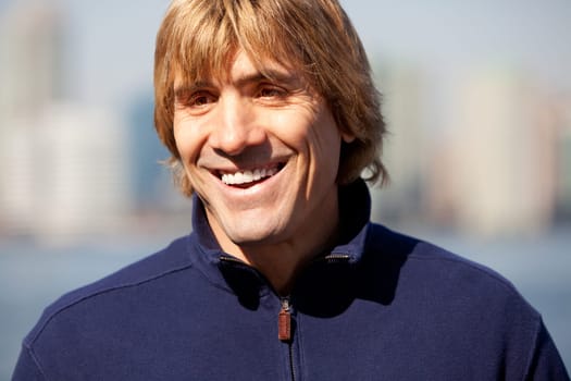 A portrait of happy man outside with a smile