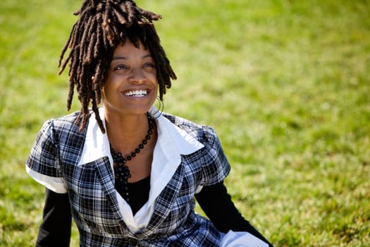 An attractive African American woman with a candid smile