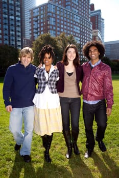 A group of college students in a park - shot against the sun with solar flare