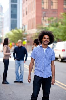 A young adult in a city setting with friends