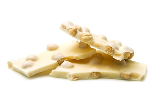 a piece of white chocolate with hazelnut