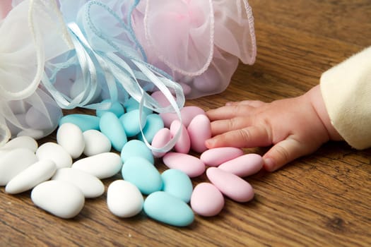 a candy favors with baby hand