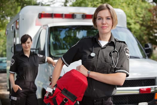 EMS professional with portable oxygen equipment