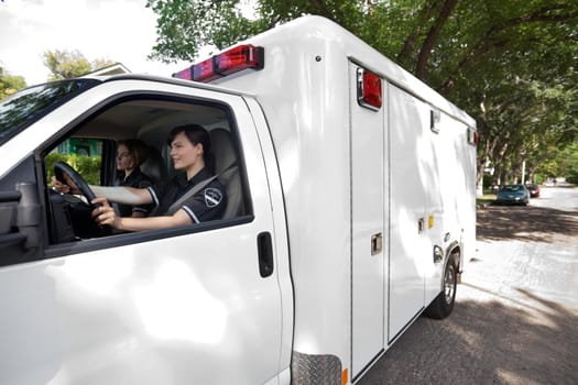 Ambulance driver on an urban street in a city