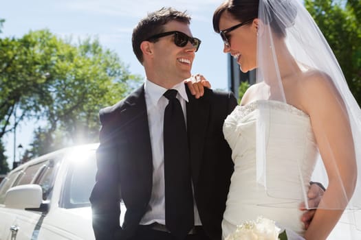 Happy married couple wearing sunglasses