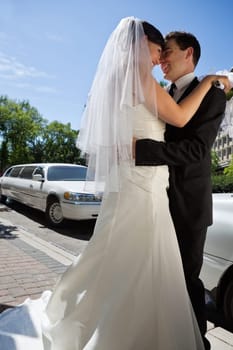 Affectionate newly wed couple hugging each other
