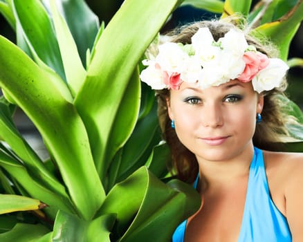 Portrait of a smiling young woman with flowers