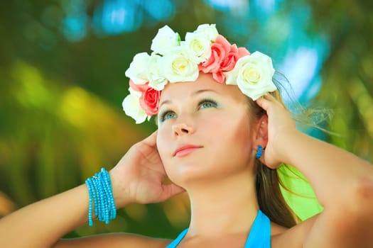 Portrait of a young beautiful woman in wreath