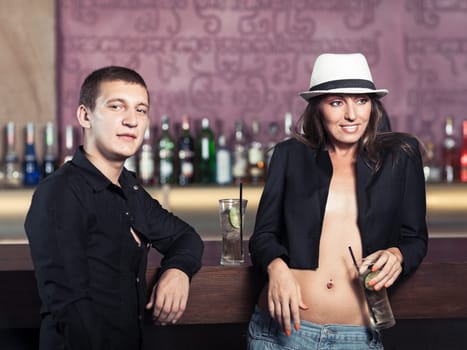 Couple in the bar. Focus on woman