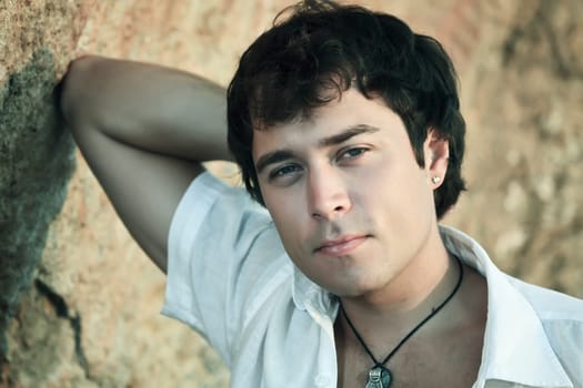 Outdoor portrait of young man of handsome presence