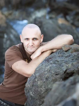 Outdoor portrait at the rocky cape of handsome men