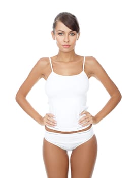 Young beautiful woman in white fitness clothing