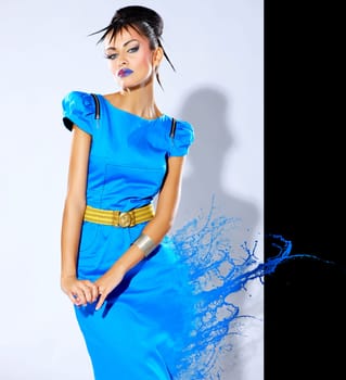 Beautiful female fashion model with paint splash