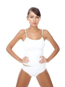Young beautiful woman in white fitness clothing
