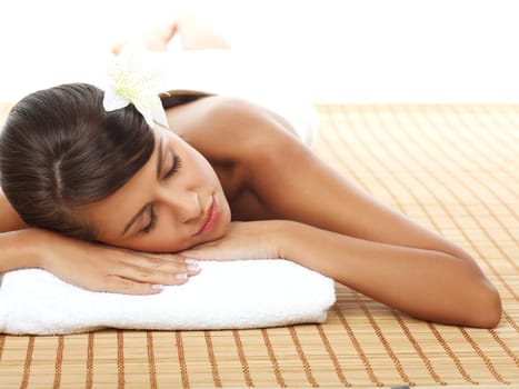 Portrait of Fresh and Beautiful woman laying on bamboo mat