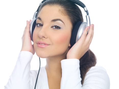 Beautiful young lady is liten to the music, isolated