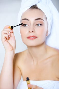 Portrait of cute teenage girl doing morning makeup