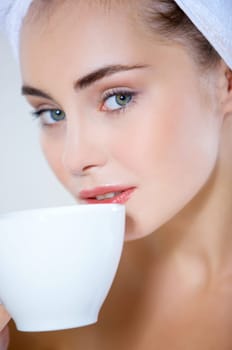 Portrait of cute teenage girl with cup of coffee