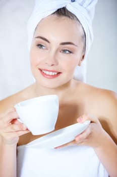 Portrait of cute teenage girl with cup of coffee