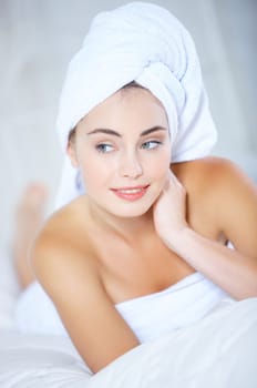 Portrait of cute teenage girl wearing towel on her head
