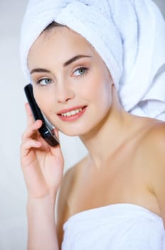 Portrait of cute teenage girl using mobile phone